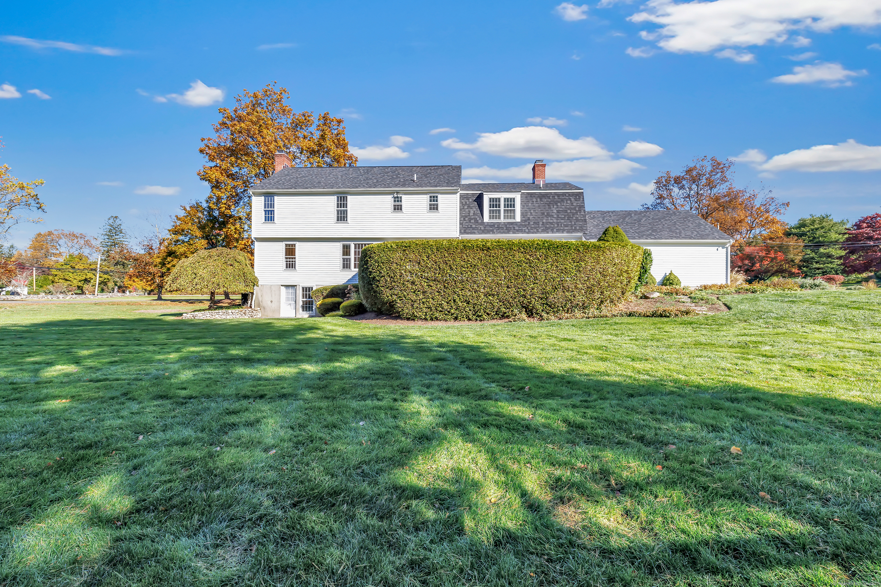 41 Butternut Lane Fairfield, CT 06890 - Photo 29 of 33 a view of a house with a big yard