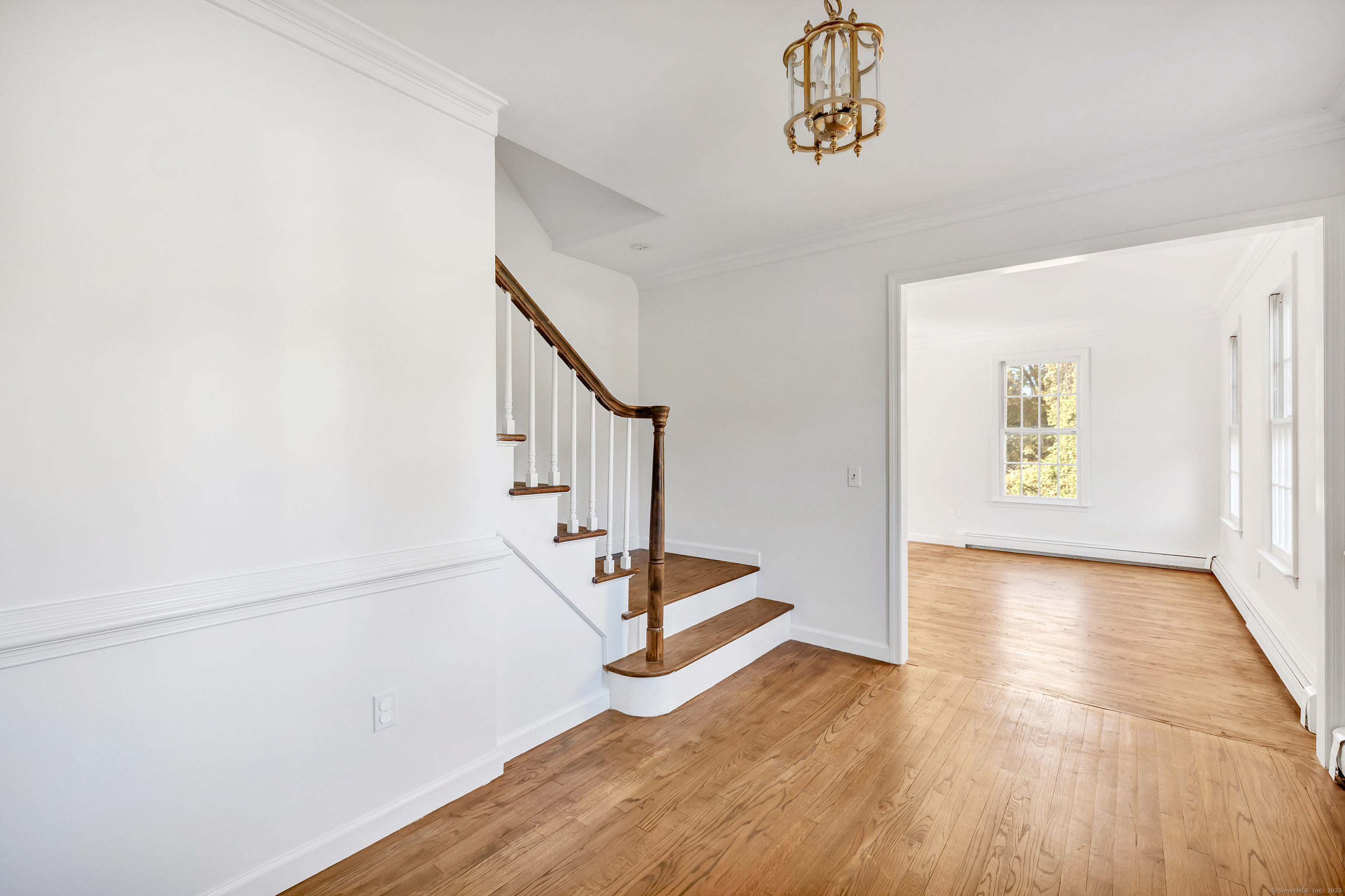 41 Butternut Lane Fairfield, CT 06890 - Photo 4 of 33 a view of an entryway with wooden floor