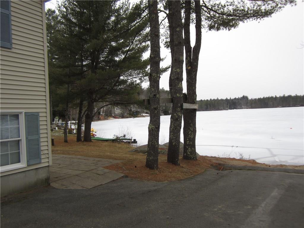 122 Thomas Pond Terrace Road Raymond, ME 04071 - Photo 2 of 13 RIGH SIDE OF HOME TO REAR PATIO...