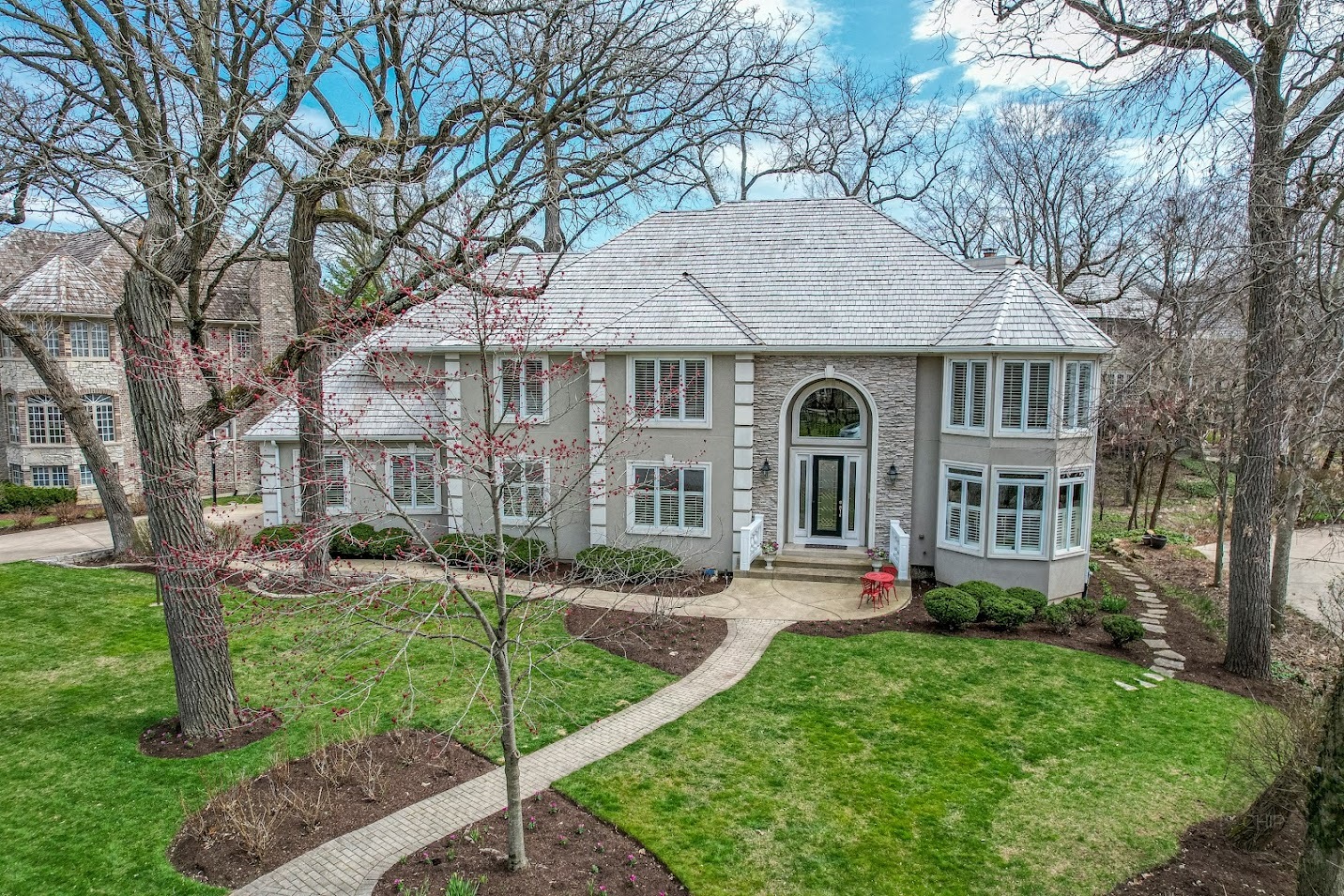 a front view of a house with a yard