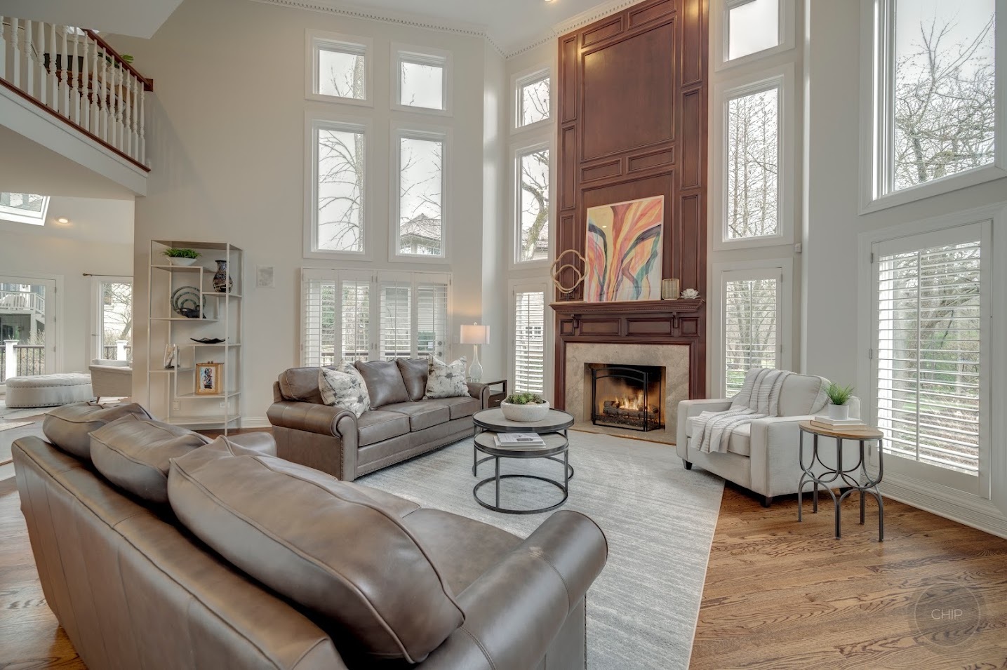 208 Crooked Tree Court Naperville, IL 60565 - Photo 21 of 97 a living room with furniture a fireplace and large windows
