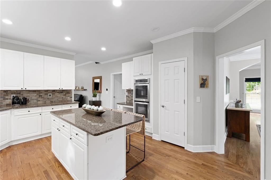 475 Laurian View Court Roswell, GA 30075 - Photo 14 of 66 a kitchen with stainless steel appliances granite countertop a sink stove and refrigerator