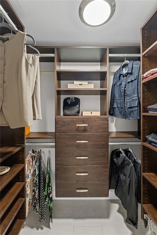 475 Laurian View Court Roswell, GA 30075 - Photo 28 of 66 a view of walk in closet with clothes and shoes