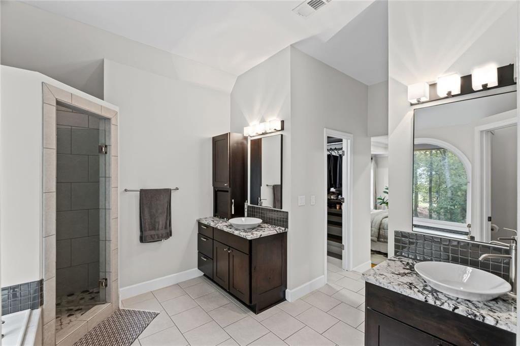 475 Laurian View Court Roswell, GA 30075 - Photo 29 of 66 a bathroom with a granite countertop sink and a mirror