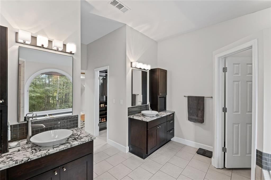 475 Laurian View Court Roswell, GA 30075 - Photo 30 of 66 a bathroom with a sink double vanity and a mirror