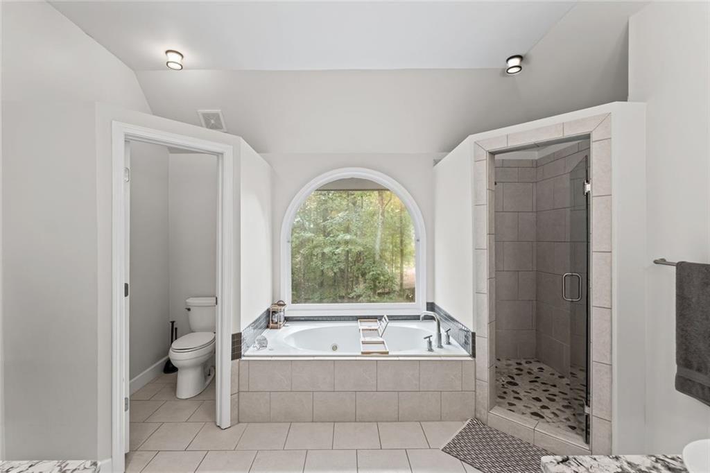 475 Laurian View Court Roswell, GA 30075 - Photo 31 of 66 a bathroom with a bathtub a toilet and a shower
