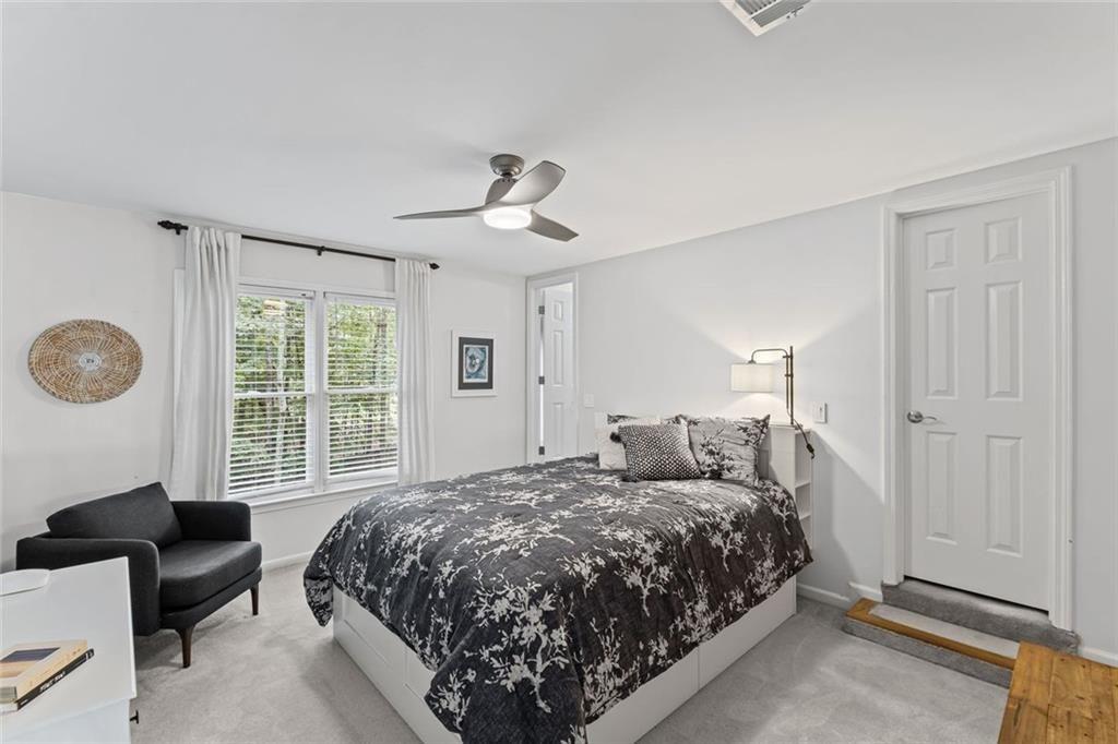 475 Laurian View Court Roswell, GA 30075 - Photo 32 of 66 a bedroom with a large bed and a window