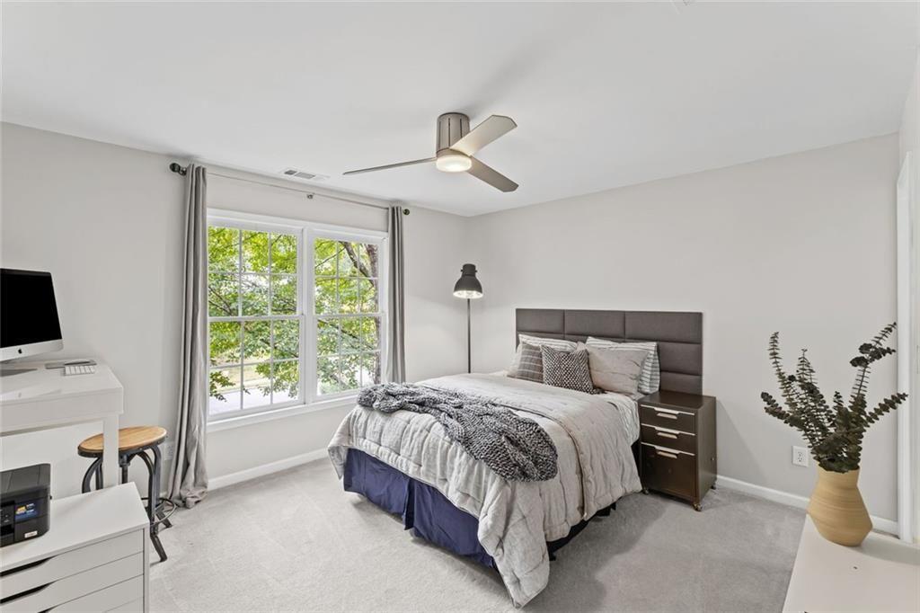 475 Laurian View Court Roswell, GA 30075 - Photo 33 of 66 a bedroom with a large bed and a window