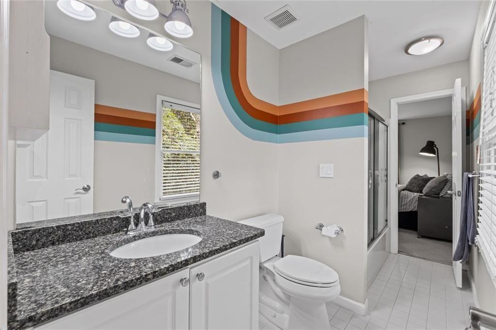 475 Laurian View Court Roswell, GA 30075 - Photo 35 of 66 a bathroom with a granite countertop sink and a mirror