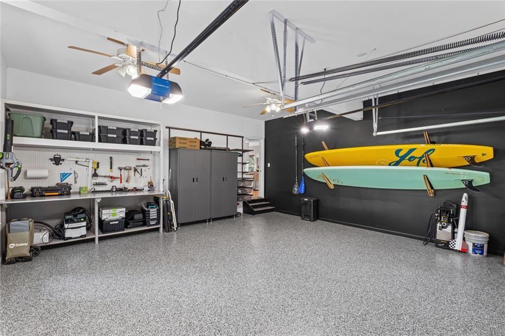 475 Laurian View Court Roswell, GA 30075 - Photo 44 of 66 a bedroom with bed and a chandelier