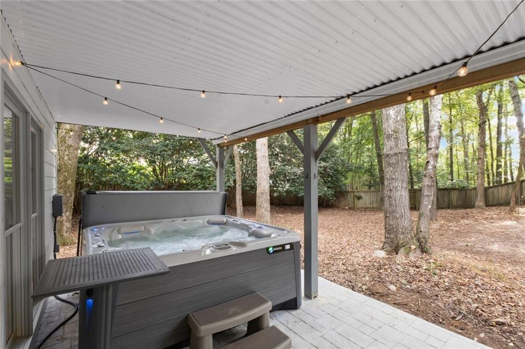 475 Laurian View Court Roswell, GA 30075 - Photo 48 of 66 a view of a patio with table and chairs in front of a house