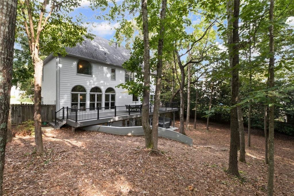 475 Laurian View Court Roswell, GA 30075 - Photo 51 of 66 a view of a house with backyard and a tree