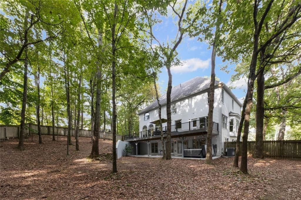 475 Laurian View Court Roswell, GA 30075 - Photo 53 of 66 a view of a house with a tree next to a yard