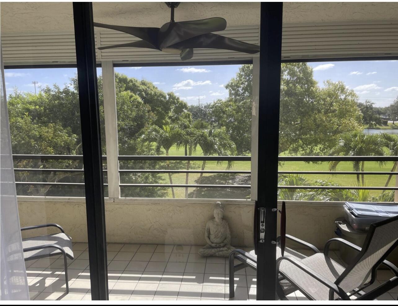 7170 Promenade Drive, Unit 301 Boca Raton, FL 33433 - Photo 7 of 7 a view of a room with a large window and sitting space