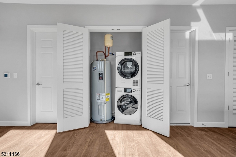 2003 Morris Avenue, Unit 305 Union, NJ 07083 - Photo 5 of 15 a view of a storage & utility room with washer and dryer