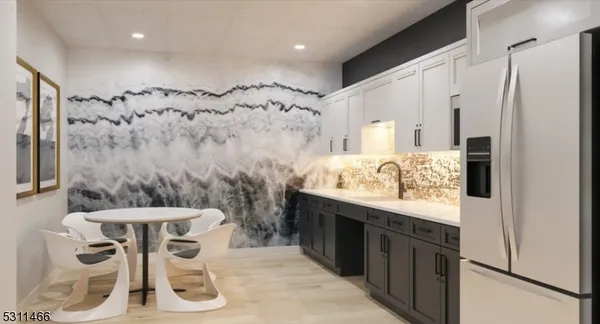 a bathroom with a granite countertop sink a mirror and a shower