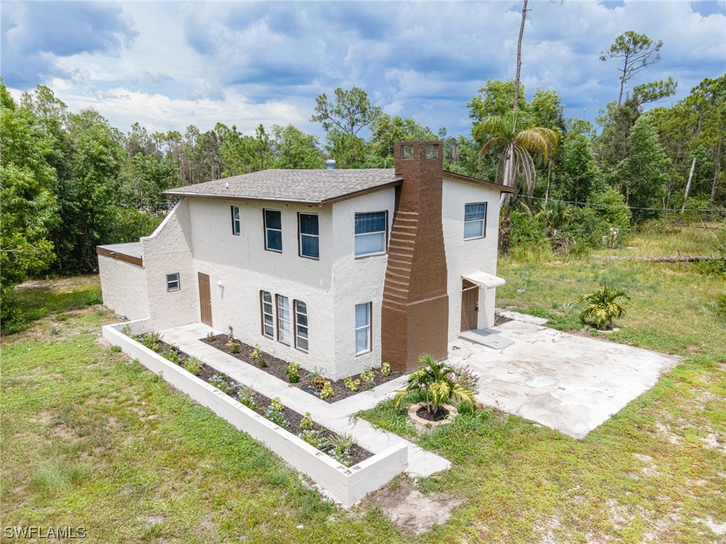12451 Shawnee Road Fort Myers, FL 33913 - Photo 1 of 39 a view of a house with backyard and garden