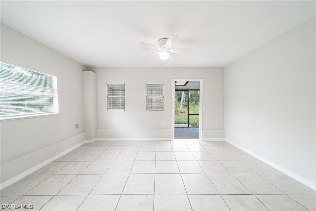 12451 Shawnee Road Fort Myers, FL 33913 - Photo 18 of 39 a view of an empty room with a window