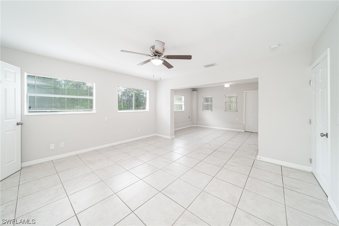 12451 Shawnee Road Fort Myers, FL 33913 - Photo 21 of 39 a view of an empty room with a window