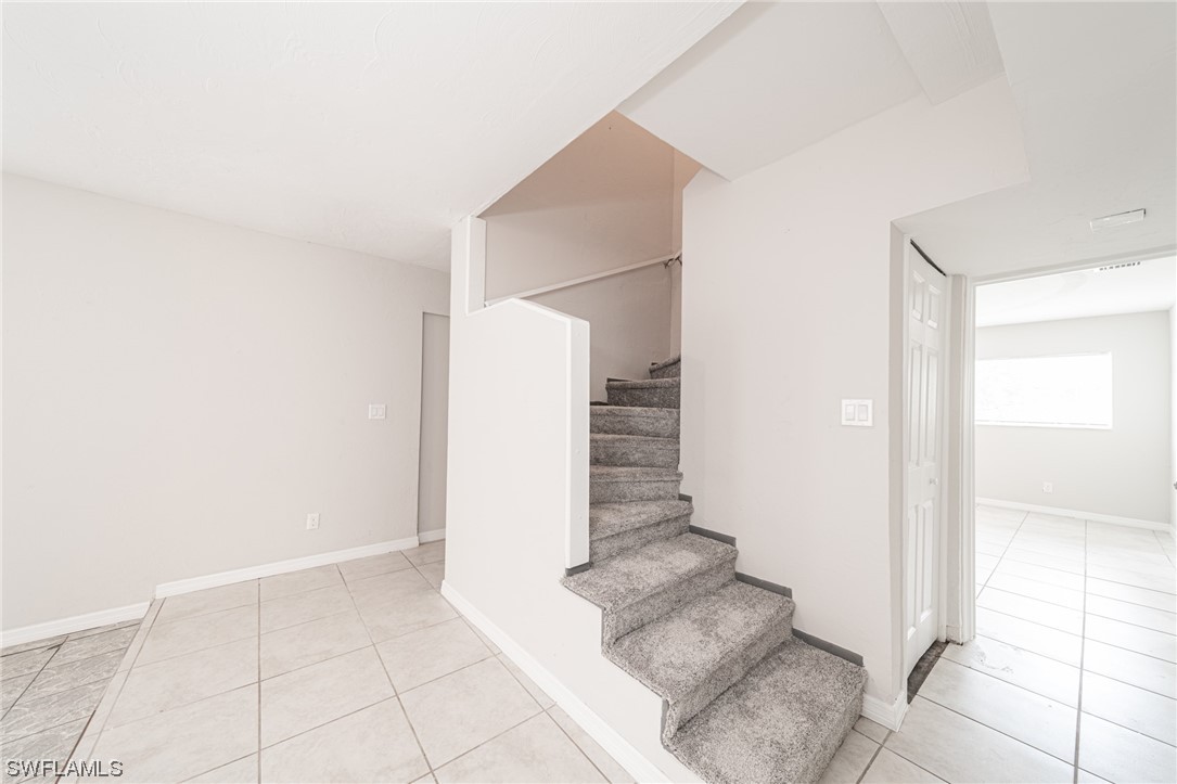 12451 Shawnee Road Fort Myers, FL 33913 - Photo 24 of 39 a view of an entryway with staircase