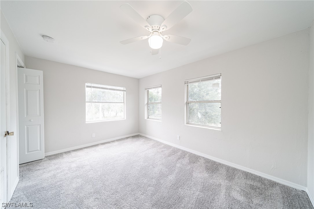 12451 Shawnee Road Fort Myers, FL 33913 - Photo 28 of 39 a view of an empty room with a window