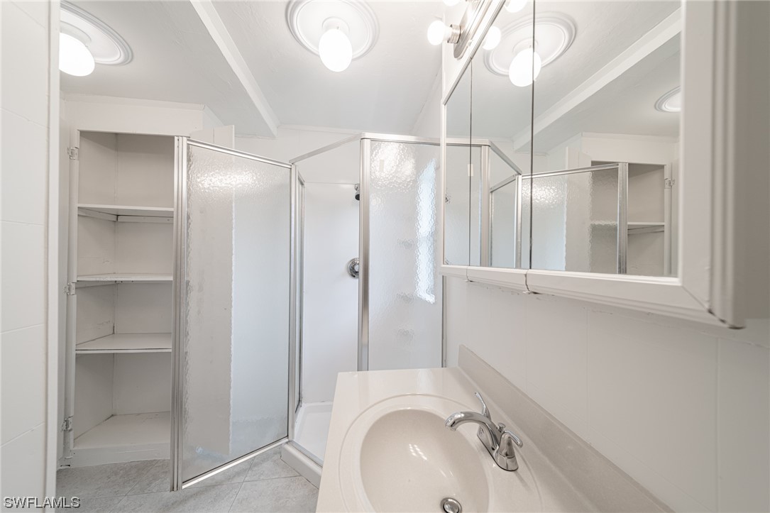12451 Shawnee Road Fort Myers, FL 33913 - Photo 29 of 39 a bathroom with a sink and a mirror