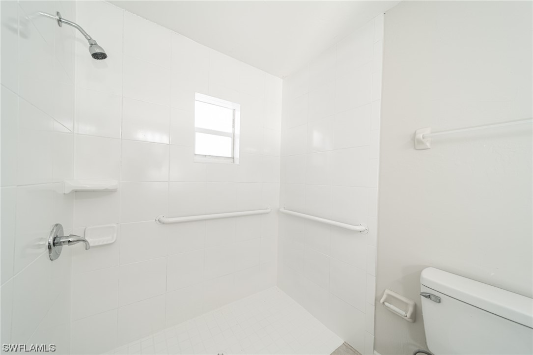 12451 Shawnee Road Fort Myers, FL 33913 - Photo 33 of 39 a bathroom with a shower