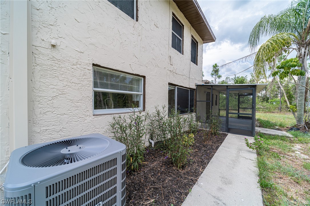 12451 Shawnee Road Fort Myers, FL 33913 - Photo 6 of 39 a house view with a backyard space