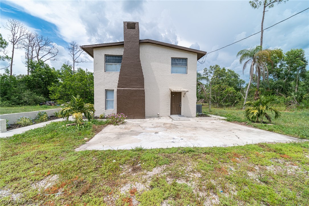12451 Shawnee Road Fort Myers, FL 33913 - Photo 9 of 39 a view of a house with a yard