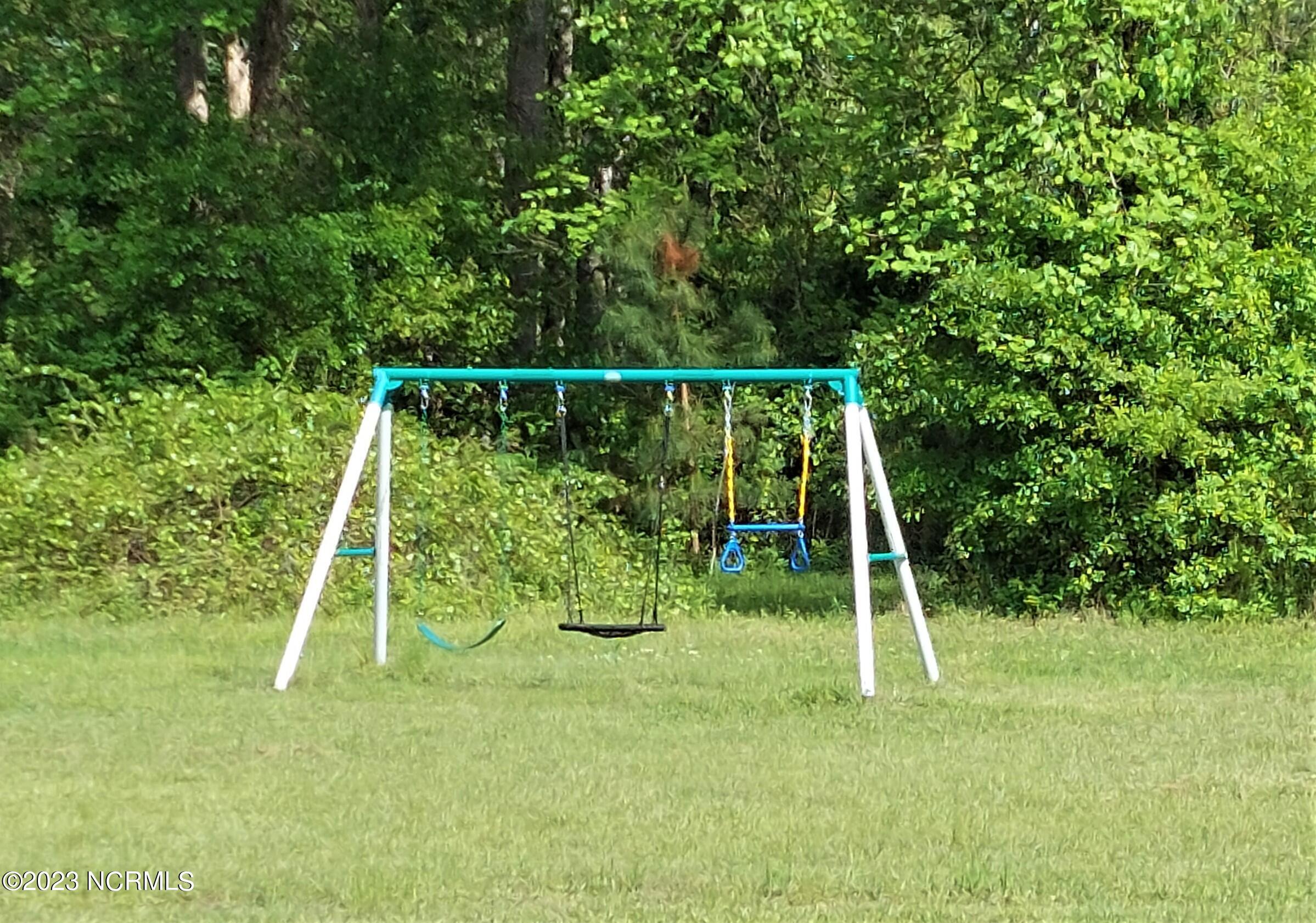 166 Baird Point Road Grantsboro, NC 28529 - Photo 9 of 39 Swing Set next to Pool Amenities