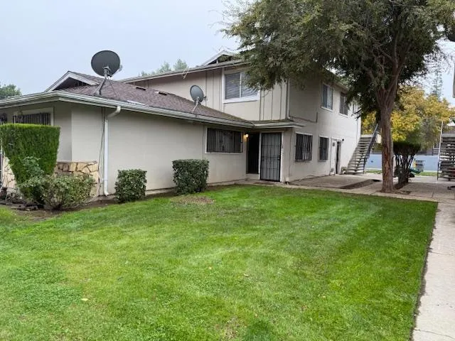 a house view with a garden space