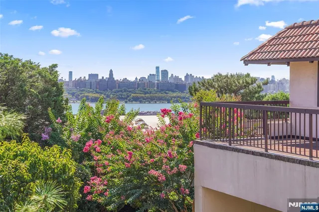 a view of a balcony with flowers