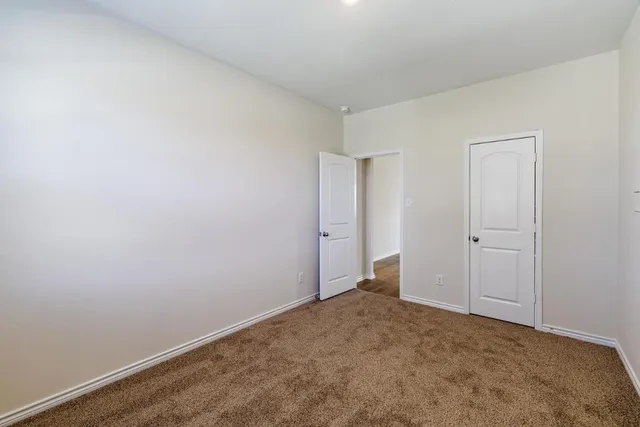 a view of an empty room and entryway