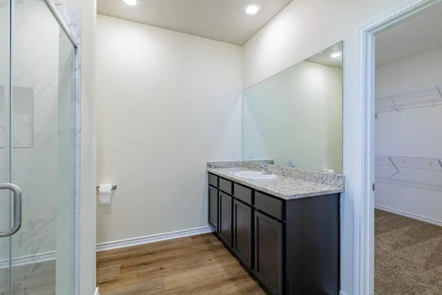 a view of a backyard with wooden fence