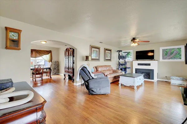 a living room with furniture and a flat screen tv