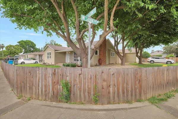 a view of outdoor space with wooden fence