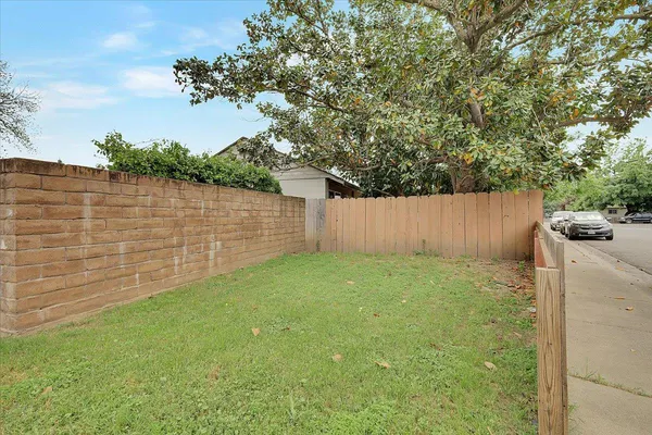 a backyard of a house with lots of green space