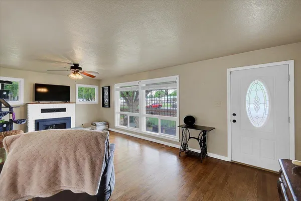 a living room with furniture and a flat screen tv