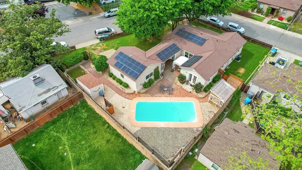 an aerial view of a house with a garden