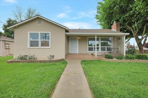 front view of a house with a yard