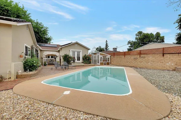 a view of a house with a swimming pool