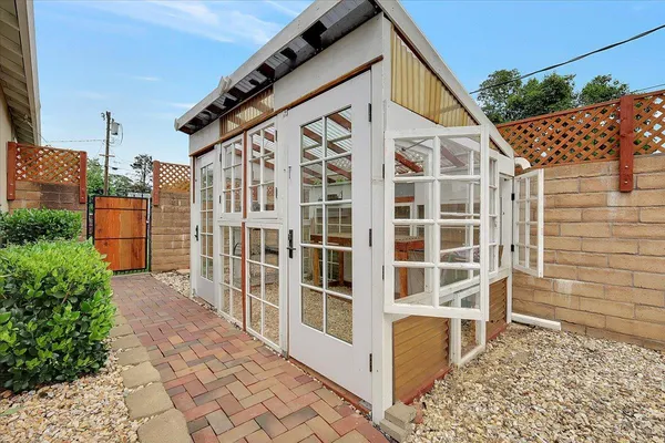 a view of front door and small yard
