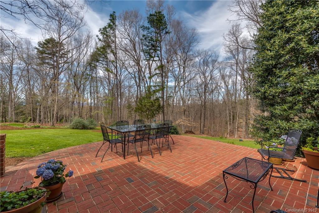 834 New Hope Road Rutherfordton, NC 28139 - Photo 29 of 35 a backyard of a house with table and chairs