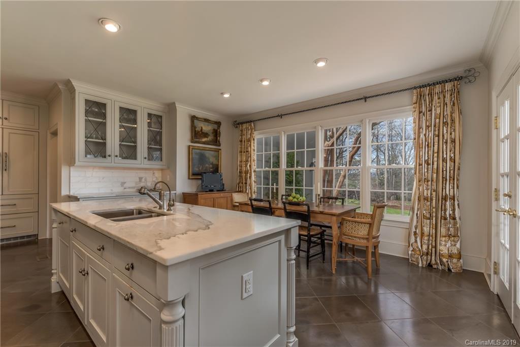 834 New Hope Road Rutherfordton, NC 28139 - Photo 9 of 35 a kitchen with a sink and chairs