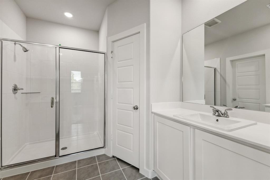 136 Millwood Road Lavon, TX 75166 - Photo 13 of 21 Primary Bathroom in the Cedar home plan by Trophy Signature Homes – REPRESENTATIVE PHOTO