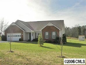 3613 Old Camden Road Monroe, NC 28110 - Photo 1 of 8 a house view with a garden space