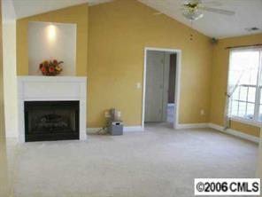 3613 Old Camden Road Monroe, NC 28110 - Photo 4 of 8 a view of an empty room with a fireplace