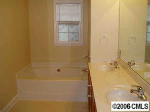 3613 Old Camden Road Monroe, NC 28110 - Photo 6 of 8 a bathroom with a bathtub
