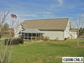 3613 Old Camden Road Monroe, NC 28110 - Photo 7 of 8 a view of a house with a yard