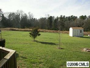 3613 Old Camden Road Monroe, NC 28110 - Photo 8 of 8 a backyard of a house with lots of green space